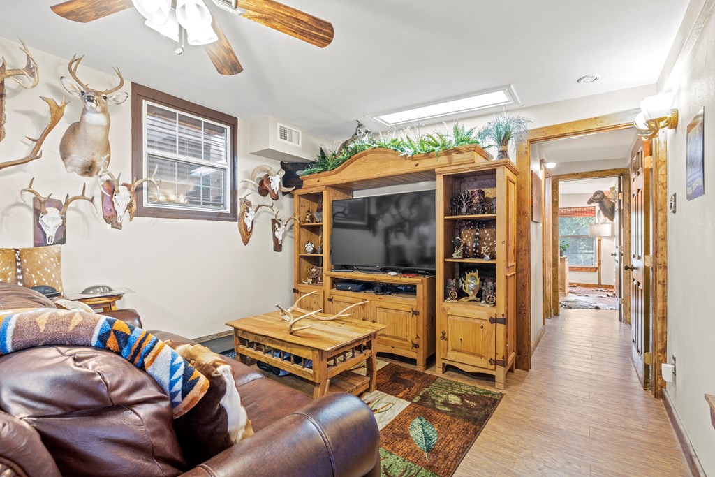 3417 Kc 443 Harper, TX 78631 - Photo 37 of 65 a living room with furniture a flat screen tv and floor to ceiling window