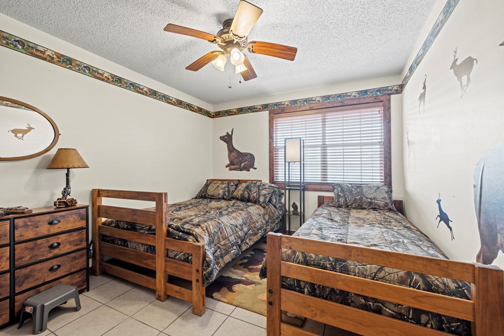 3417 Kc 443 Harper, TX 78631 - Photo 47 of 65 a bedroom with a bed and a chandelier