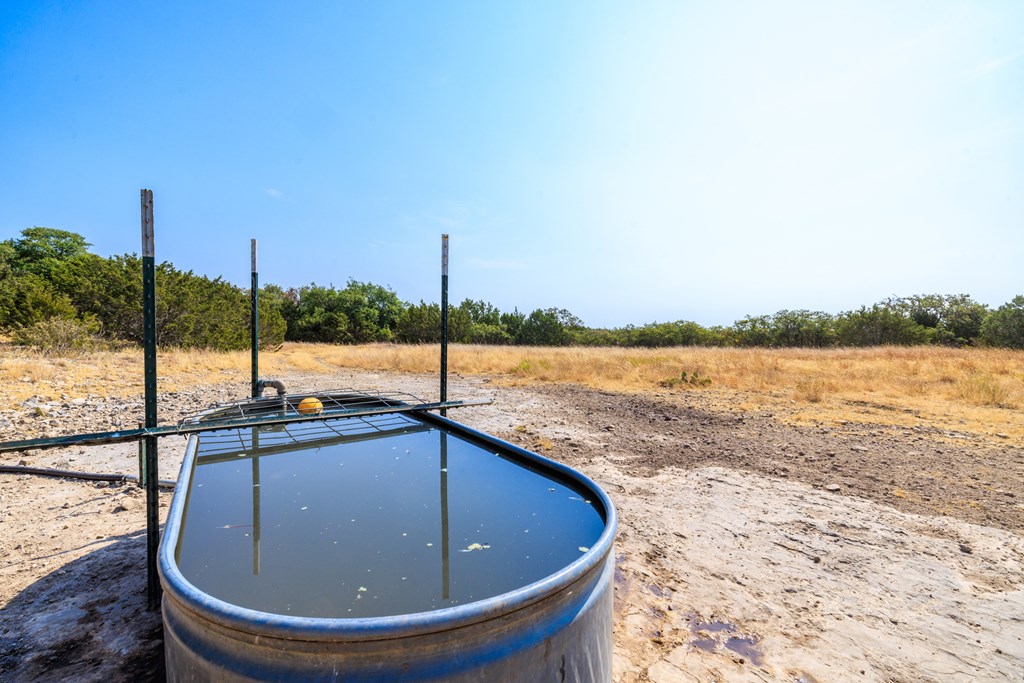 3417 Kc 443 Harper, TX 78631 - Photo 51 of 65 a view of a swimming pool with a lake from a window