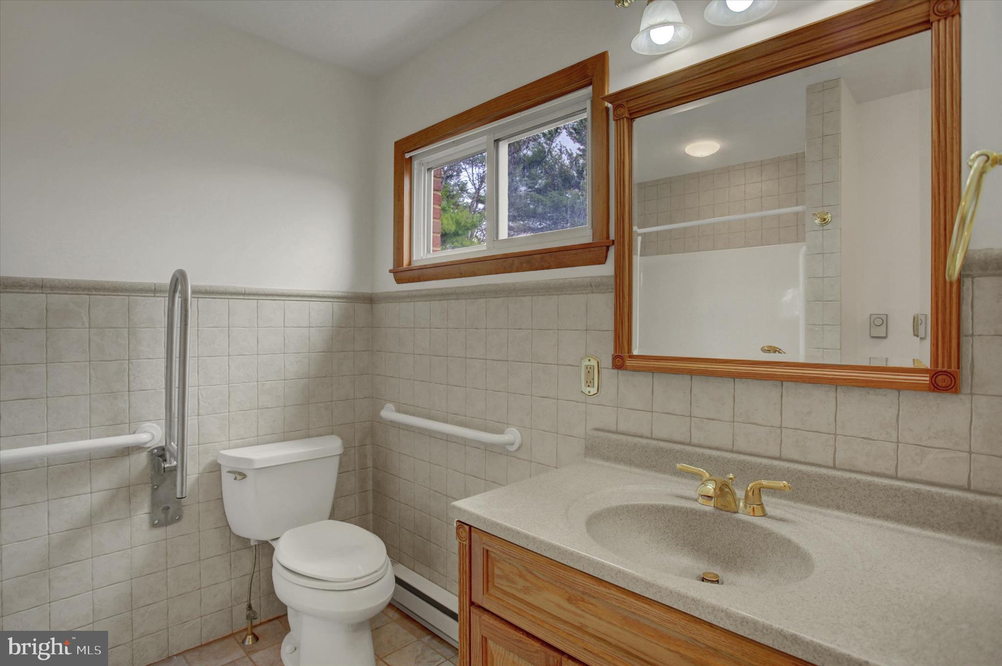 18514 Indian Cottage Road Hagerstown, MD 21742 - Photo 13 of 56 a bathroom with a sink toilet and shower