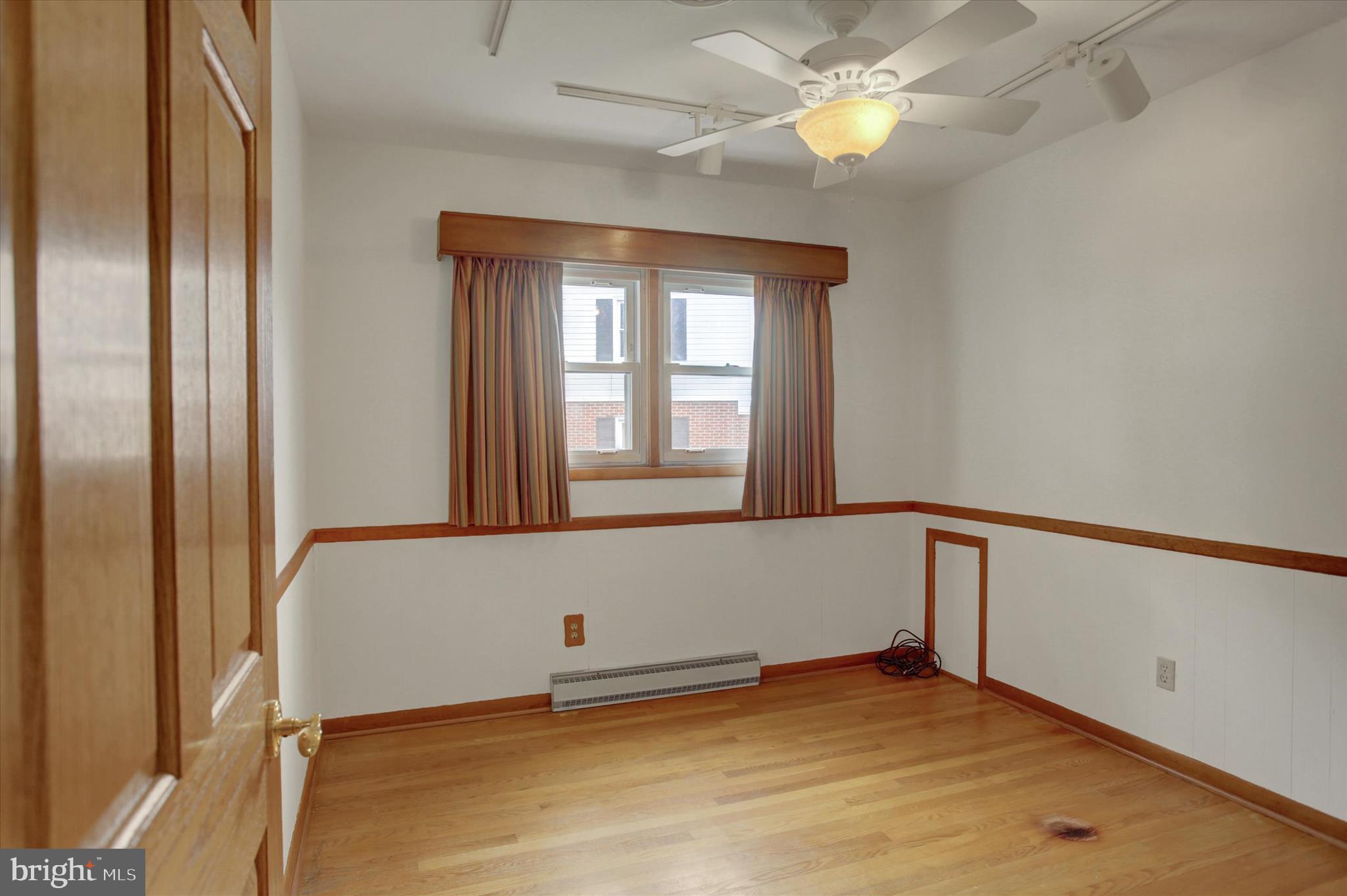 18514 Indian Cottage Road Hagerstown, MD 21742 - Photo 16 of 56 a view of an empty room with window and chandelier fan