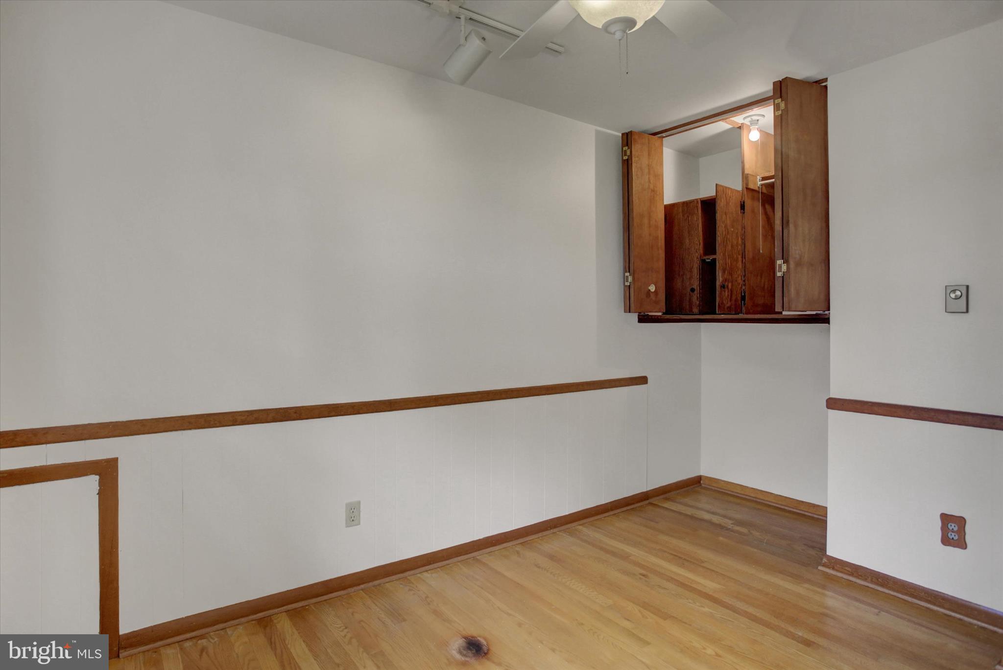 18514 Indian Cottage Road Hagerstown, MD 21742 - Photo 17 of 56 a view of an empty room with wooden floor and a window