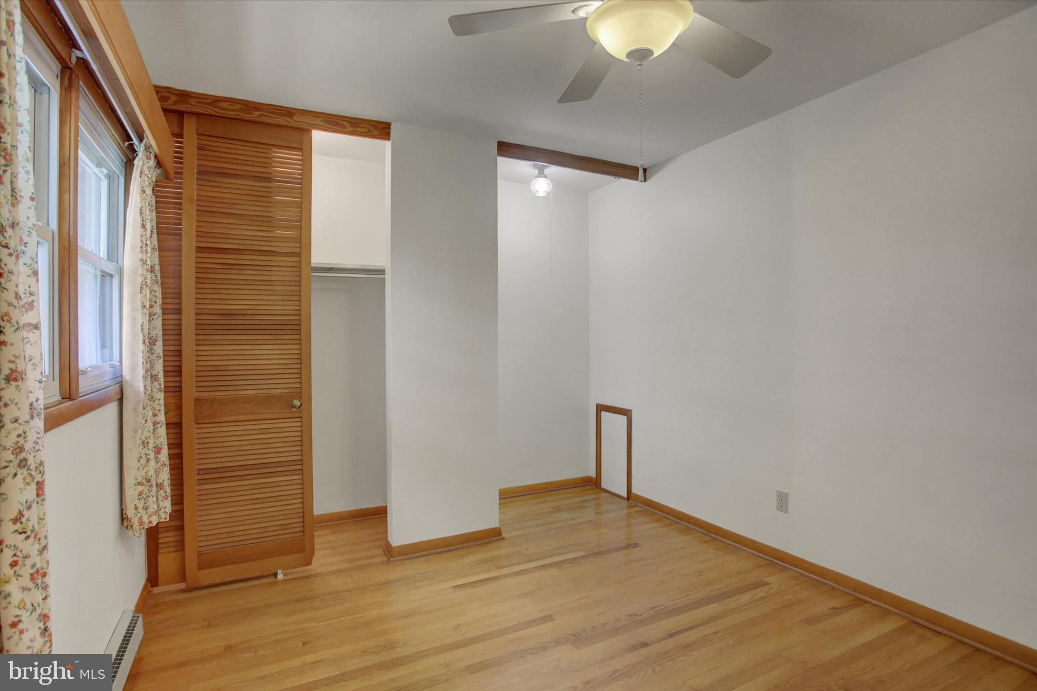 18514 Indian Cottage Road Hagerstown, MD 21742 - Photo 21 of 56 a view of empty room with wooden floor and fan