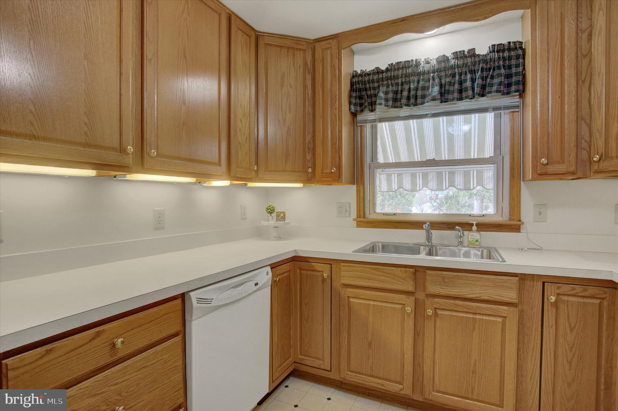 18514 Indian Cottage Road Hagerstown, MD 21742 - Photo 28 of 56 a kitchen with a sink cabinets and window