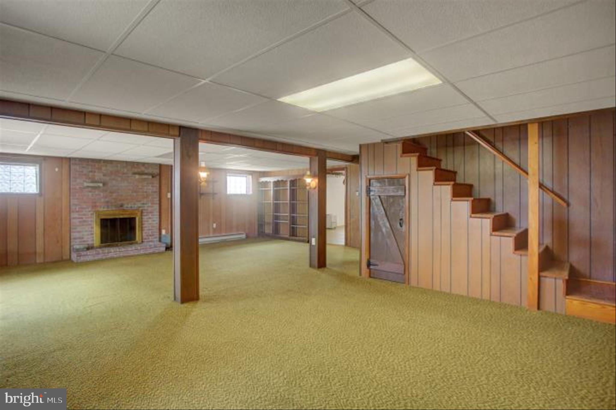 18514 Indian Cottage Road Hagerstown, MD 21742 - Photo 36 of 56 a view of an empty room with a fireplace and a window