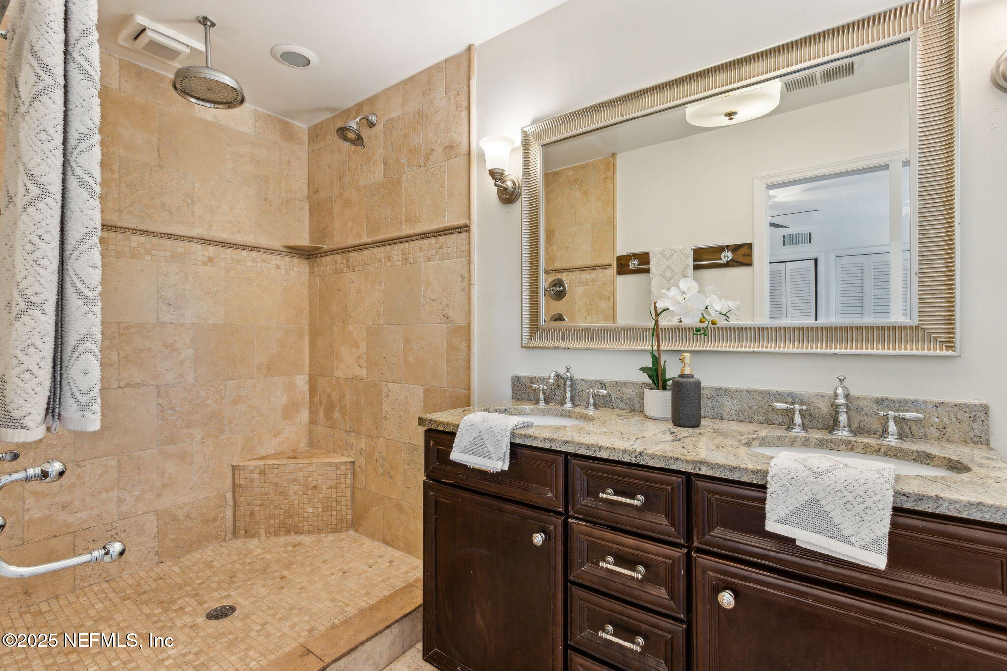 4646 Homestead Road Jacksonville, FL 32210 - Photo 15 of 34 a bathroom with a granite countertop sink mirror and a bathtub