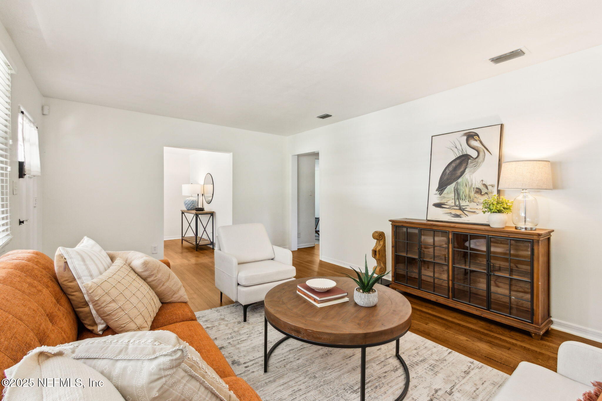 4646 Homestead Road Jacksonville, FL 32210 - Photo 5 of 34 a living room with furniture and a potted plant