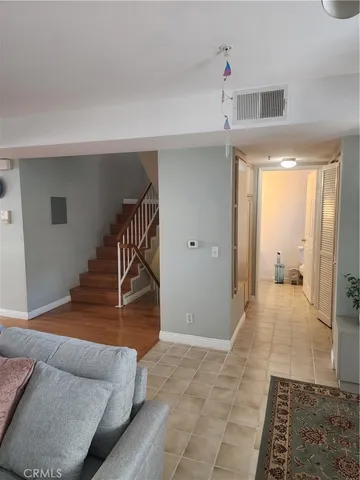a view of wooden floor and windows in a room