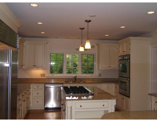 4 Ridgeway Road Wellesley, MA 02481 - Photo 4 of 16 a kitchen with stainless steel appliances granite countertop a sink stove and refrigerator