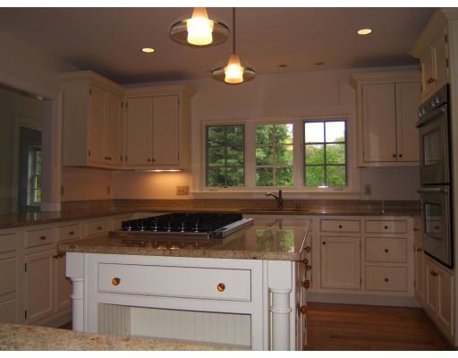 4 Ridgeway Road Wellesley, MA 02481 - Photo 9 of 16 a kitchen with granite countertop a stove sink and cabinets