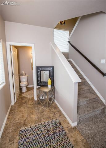 2095 Reed Grass Way Colorado Springs, CO 80915 - Photo 3 of 30 Large entry way with ceramic tile. Half bath off the front door.