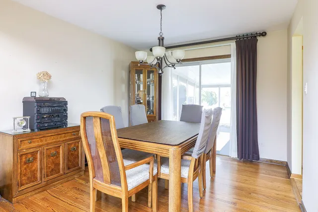 a dining room with furniture and window