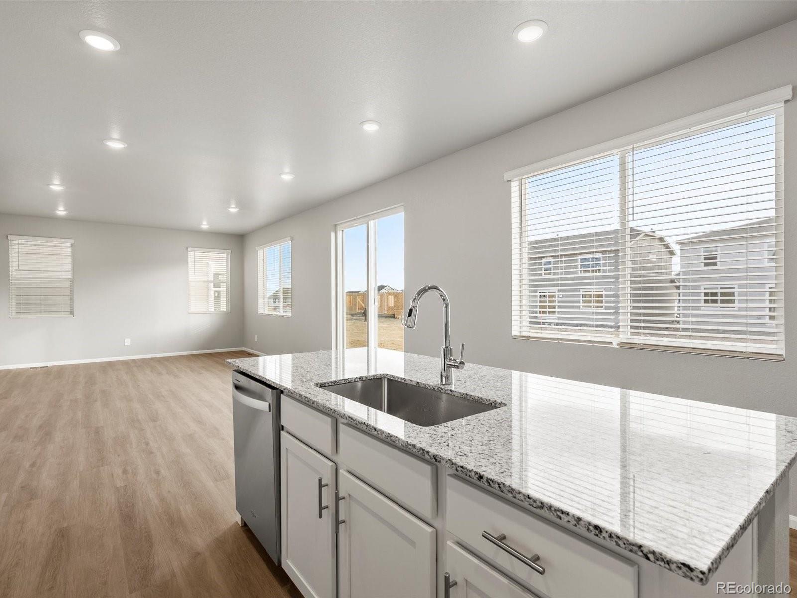 4674 Rabbitbrush Street Johnstown, CO 80534 - Photo 11 of 29 a kitchen with a sink and large window