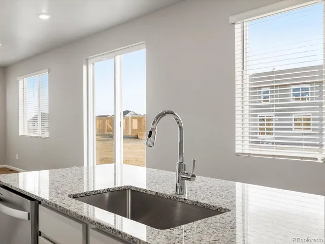 a kitchen with a sink and a window
