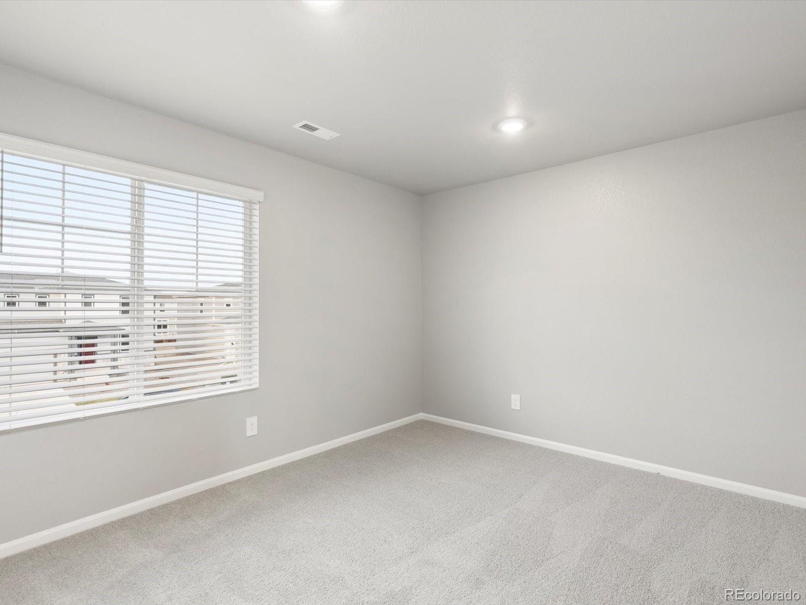 4674 Rabbitbrush Street Johnstown, CO 80534 - Photo 17 of 29 an empty room with a window