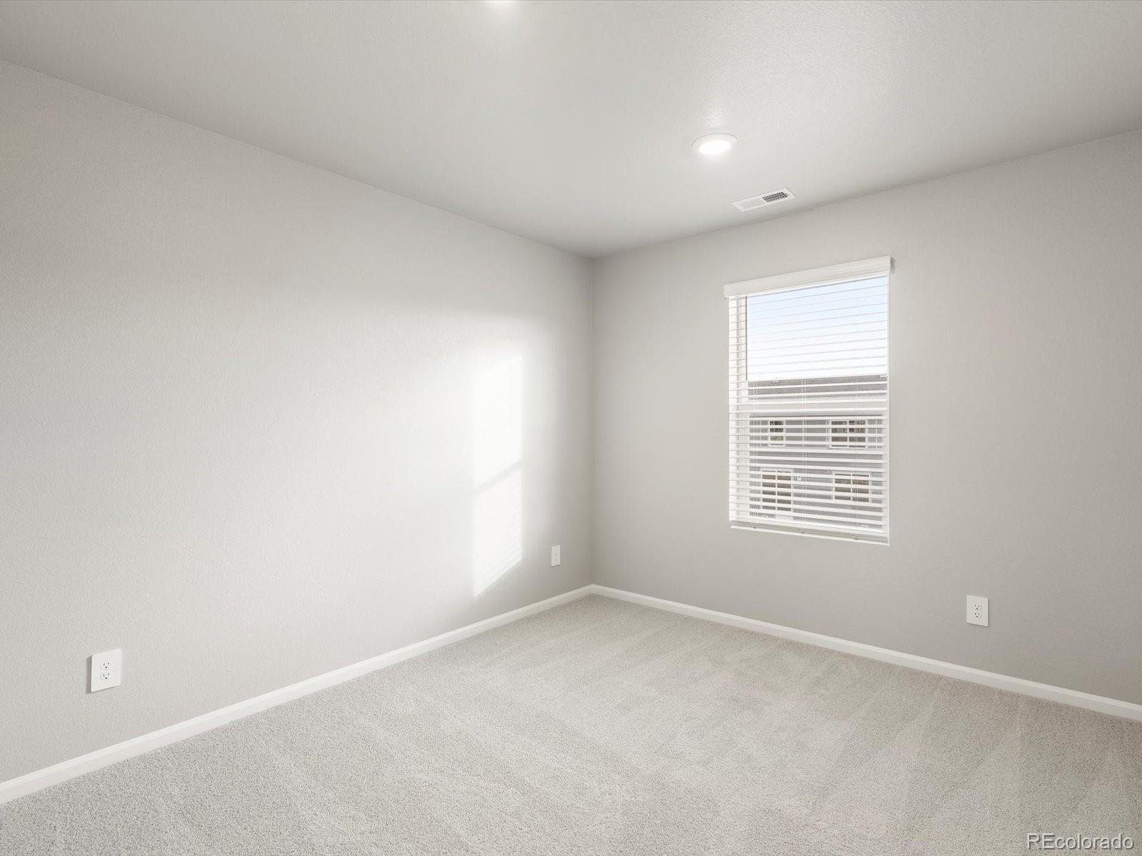 4674 Rabbitbrush Street Johnstown, CO 80534 - Photo 18 of 29 an empty room with a window