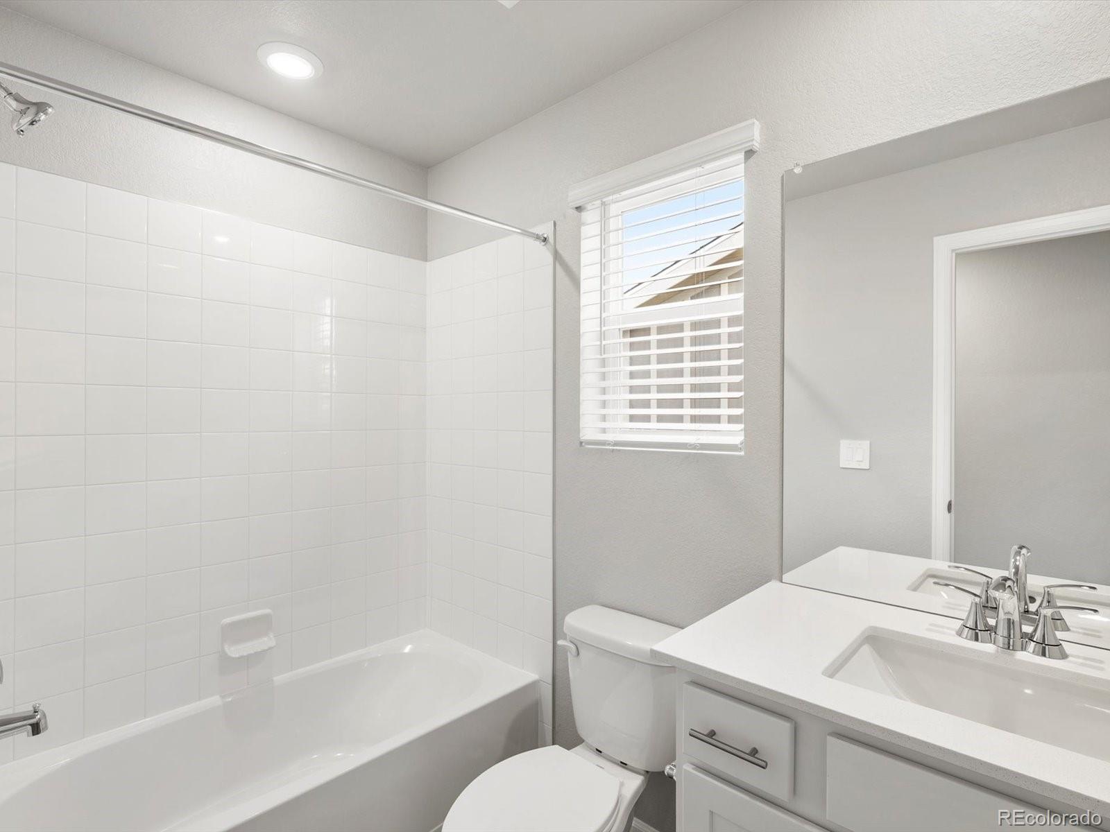 4674 Rabbitbrush Street Johnstown, CO 80534 - Photo 19 of 29 a bathroom with a sink toilet and shower