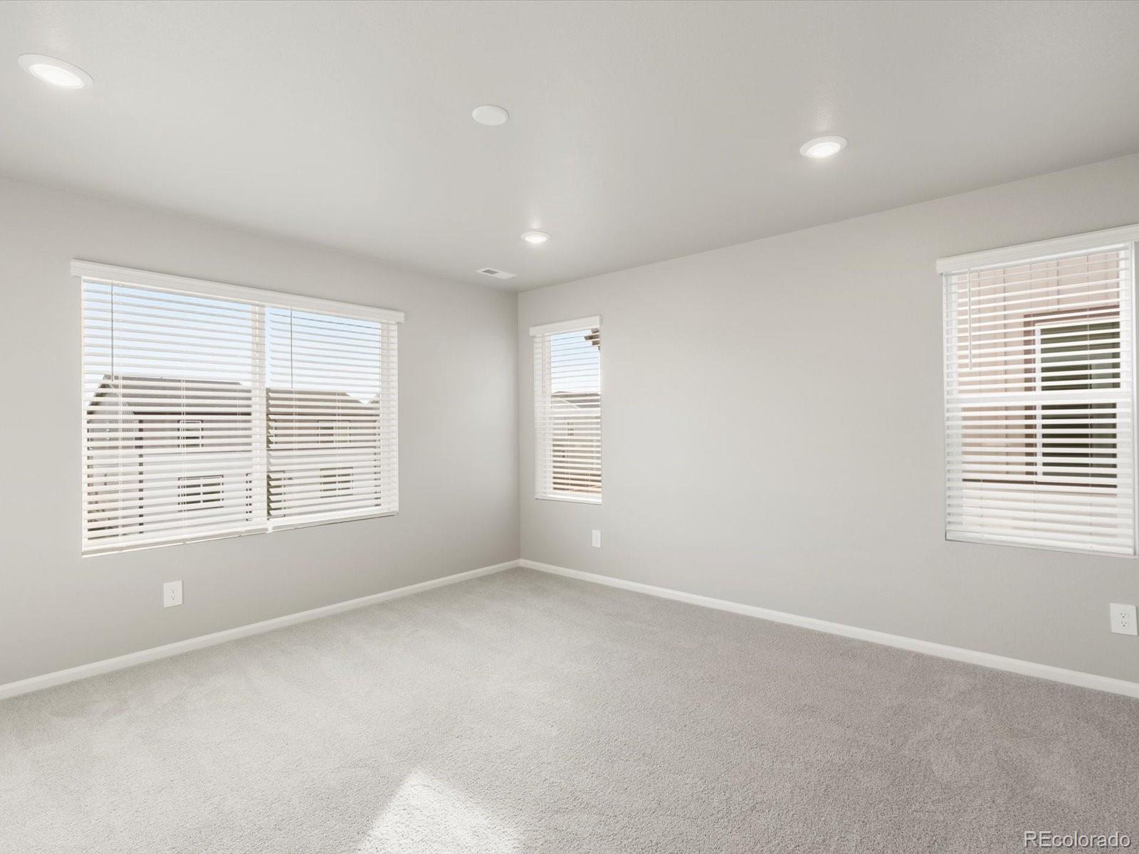 4674 Rabbitbrush Street Johnstown, CO 80534 - Photo 21 of 29 a view of an empty room with a window