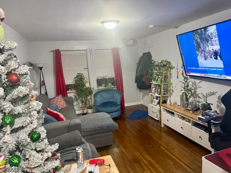 723 Thomas Street, Unit 1L Elizabeth, NJ 07202 - Photo 6 of 7 a living room with furniture and flowers