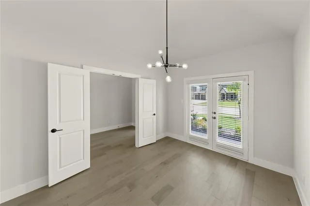 a bathroom with a tub a sink a mirror and a shower