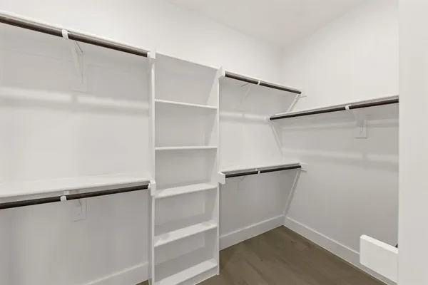 a kitchen with stainless steel appliances kitchen island granite countertop a refrigerator and a stove top oven
