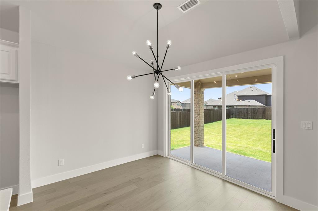 1317 Flamingo Road Forney, TX 75126 - Photo 17 of 39 a view of an empty room with a window
