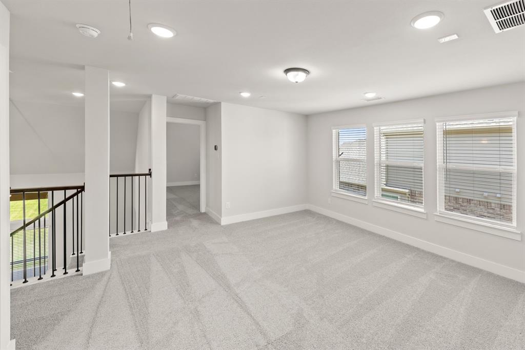 1317 Flamingo Road Forney, TX 75126 - Photo 18 of 39 an empty room with windows