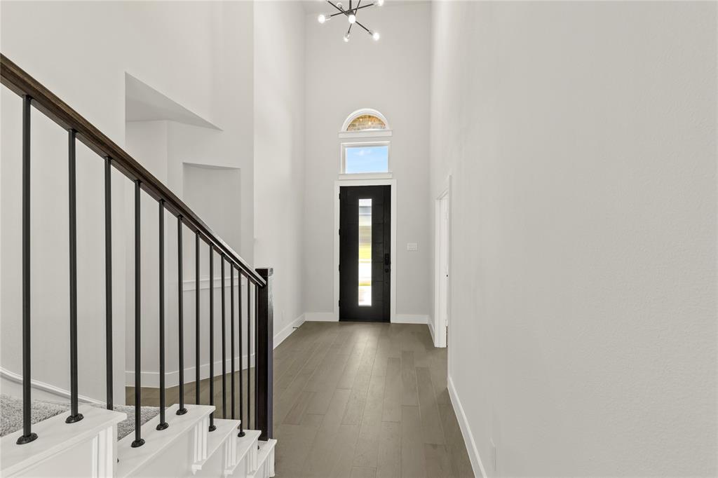 1317 Flamingo Road Forney, TX 75126 - Photo 3 of 39 a view of a hallway view with staircase