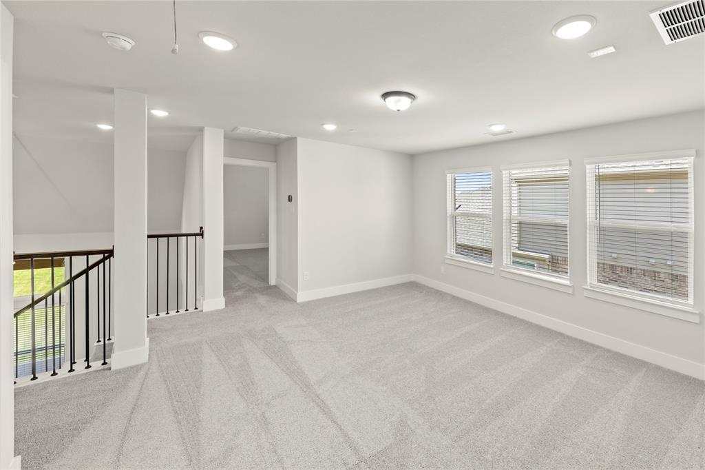 1317 Flamingo Road Forney, TX 75126 - Photo 35 of 39 an empty room with windows