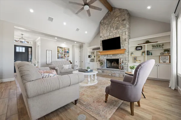 a living room with furniture and a fireplace