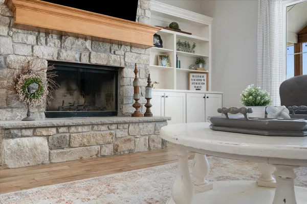 a large kitchen with stainless steel appliances kitchen island granite countertop a large center island and a wooden floors