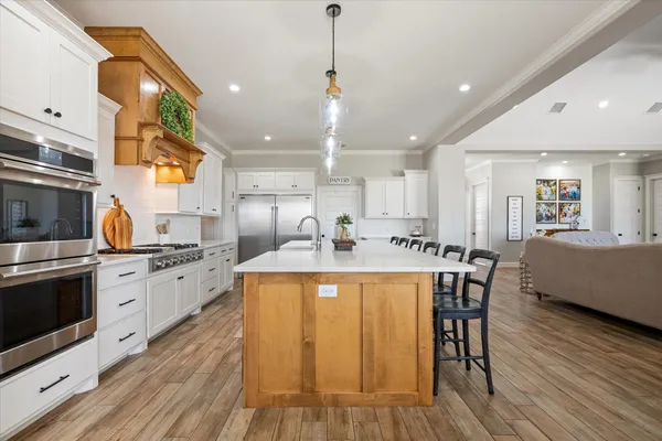a spacious bedroom with a bed and a window