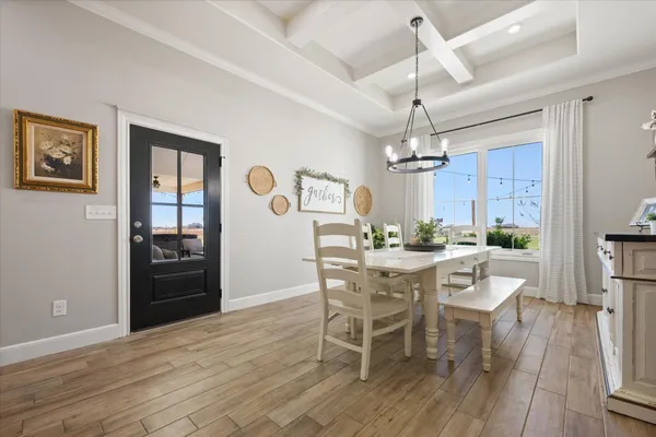 a spacious bedroom with a bed and painting on the wall