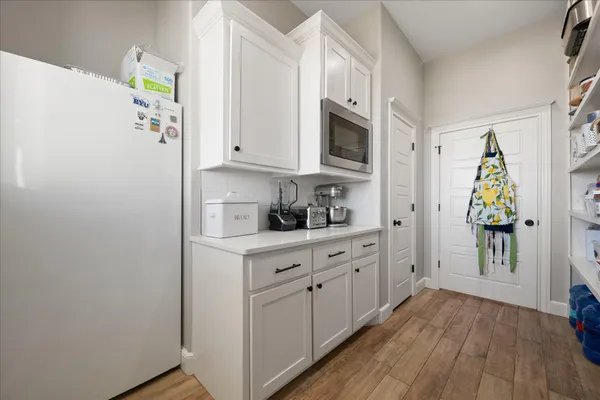 a spacious bathroom with a granite countertop sink mirror and a
