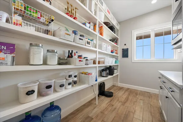 a white tub sitting next to a shower