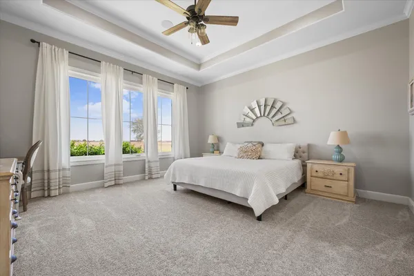 a spacious bathroom with a granite countertop sink mirror and a