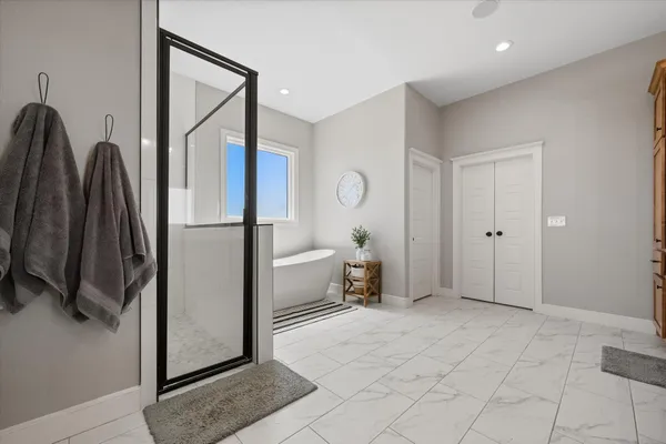 a bathroom with a toilet a sink a mirror and vanity