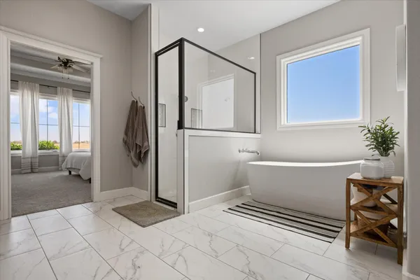 a bedroom with a bed and window