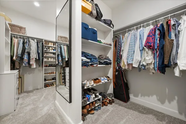 a white toilet sitting next to a shower