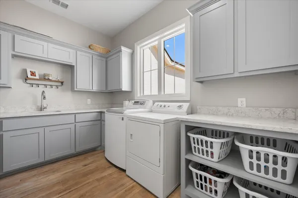 a spacious bedroom with a bed and a couch