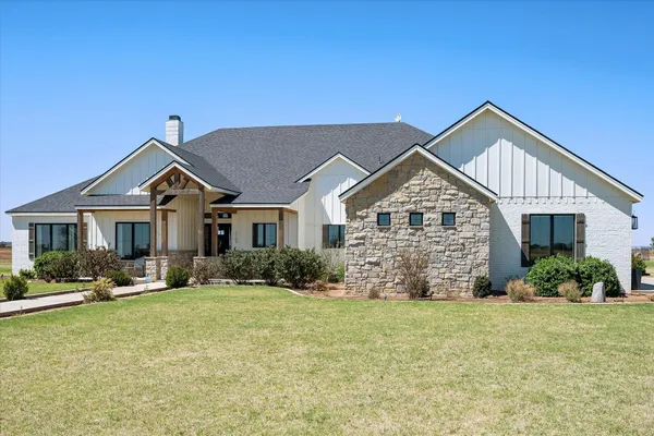 a workspace with furniture and window