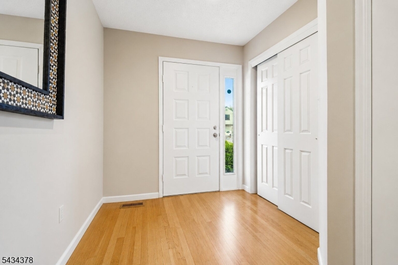 606 Park Place Springfield, NJ 07081 - Photo 4 of 21 a view of an empty room with wooden floor