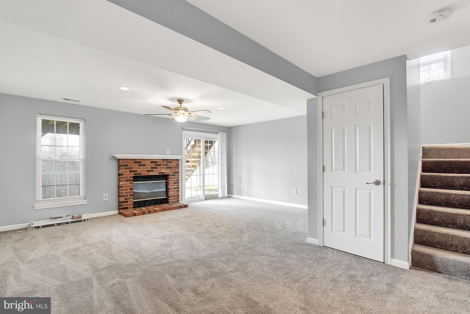 4418 Cole Farm Road Baltimore, MD 21236 - Photo 21 of 24 Lower lvl. family room w/wood fp-walkout to patio