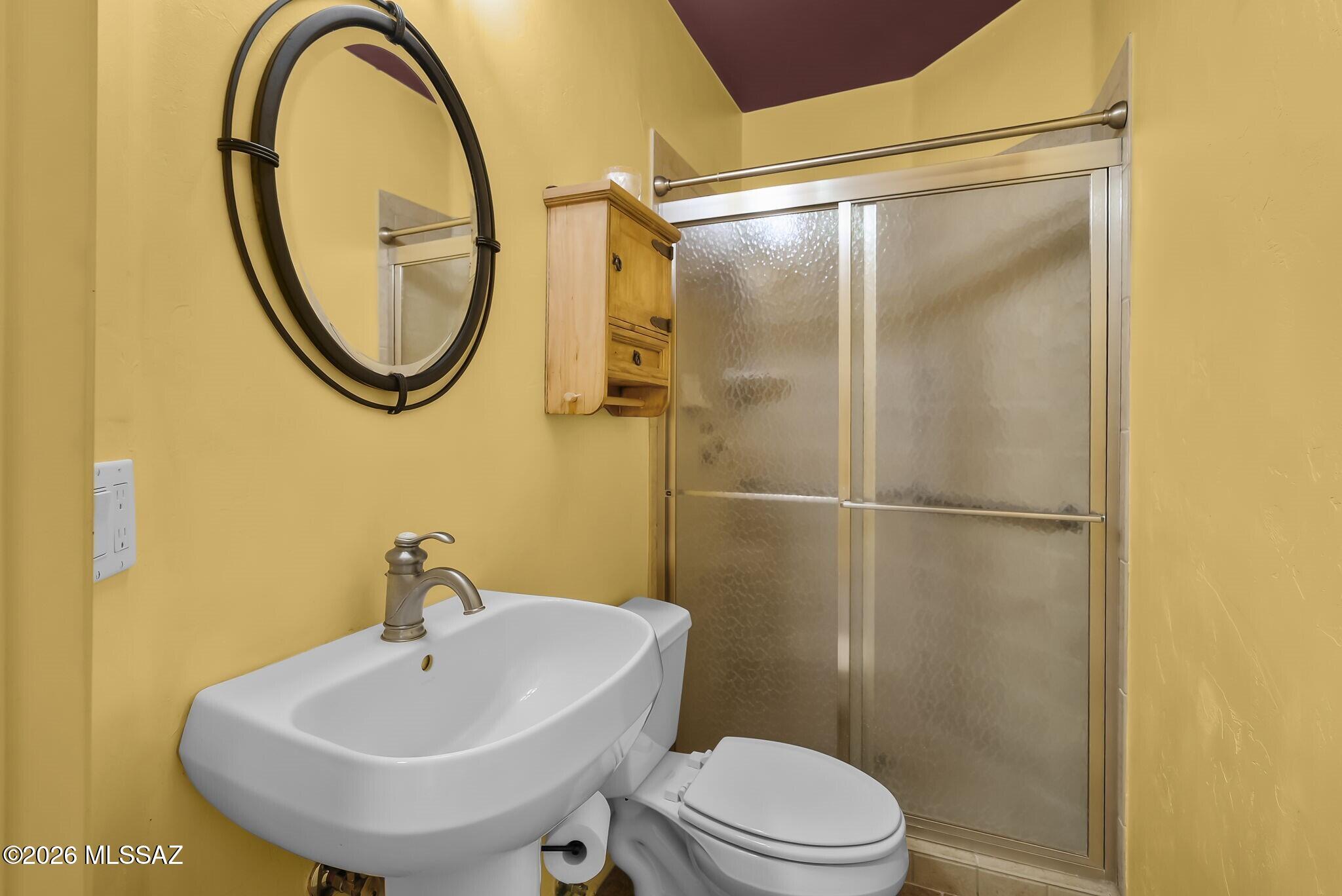 101 Post Way Tubac, AZ 85646 - Photo 11 of 31 a bathroom with a sink and a mirror