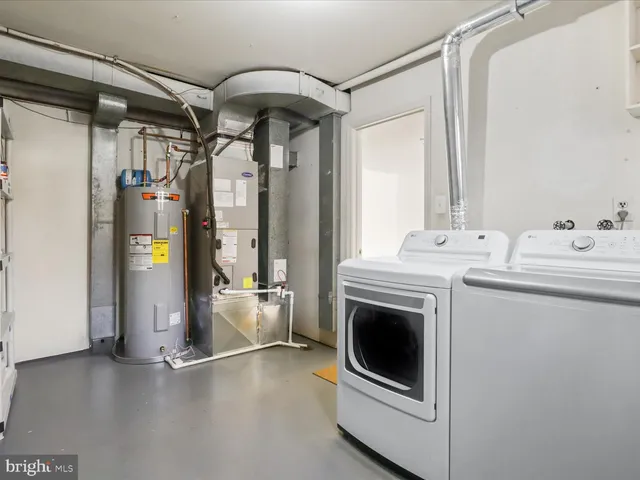 a view of a storage & utility room with washer and dryer