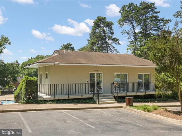 a view of a house with a iron fence