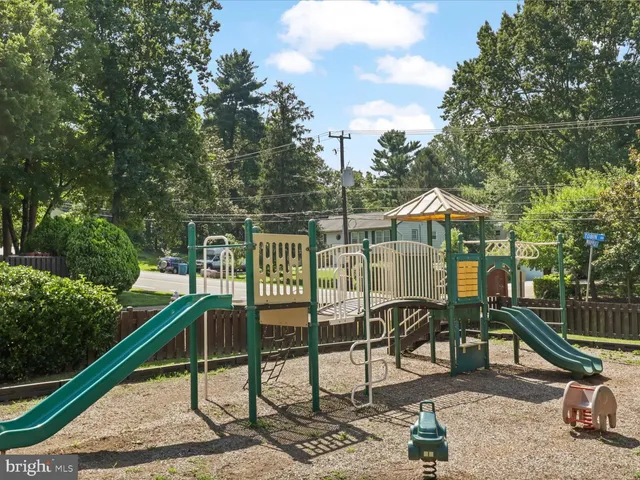 a view of a chair and tables in the balcony