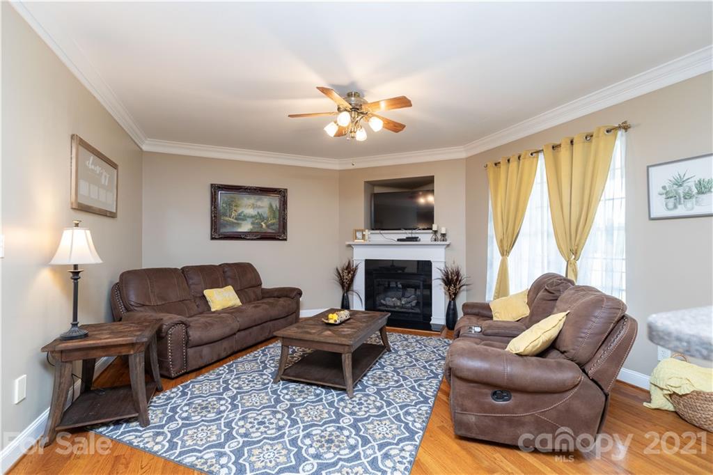 196 Cedar Grove Road York, SC 29745 - Photo 14 of 45 a living room with furniture a fireplace and a flat screen tv