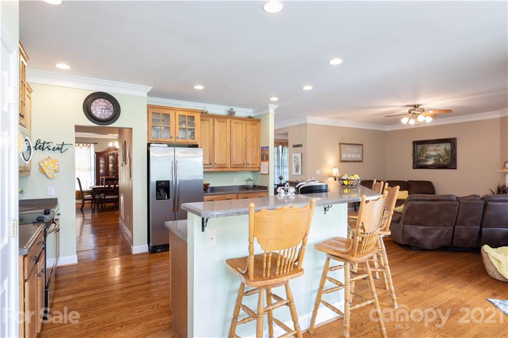 196 Cedar Grove Road York, SC 29745 - Photo 16 of 45 a view of a dining room kitchen with furniture and a large window