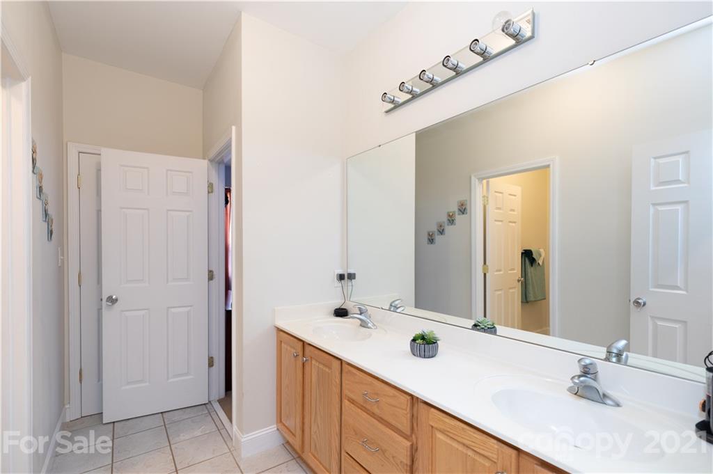 196 Cedar Grove Road York, SC 29745 - Photo 23 of 45 a bathroom with a double vanity sink and a mirror
